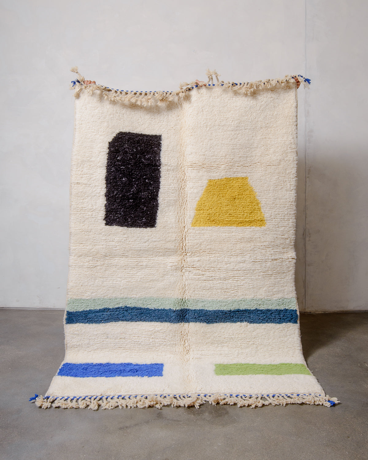 Modern, designer, handcrafted Berber rug from Morocco. Beniourain carpet with beautiful colours and patterns and fluffy wool texture.